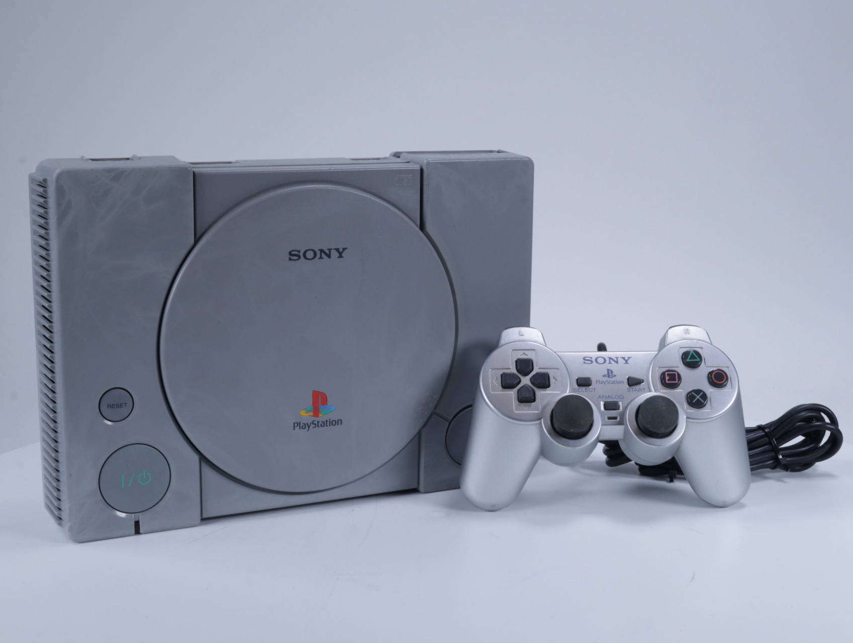 Playstation 1 - Console [Verkleurt / Dualshock 2 Controller]